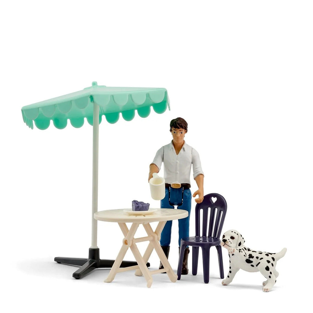 Schleich Coffee Chat pocket set with two hand-painted figures seated at a miniature cafe table