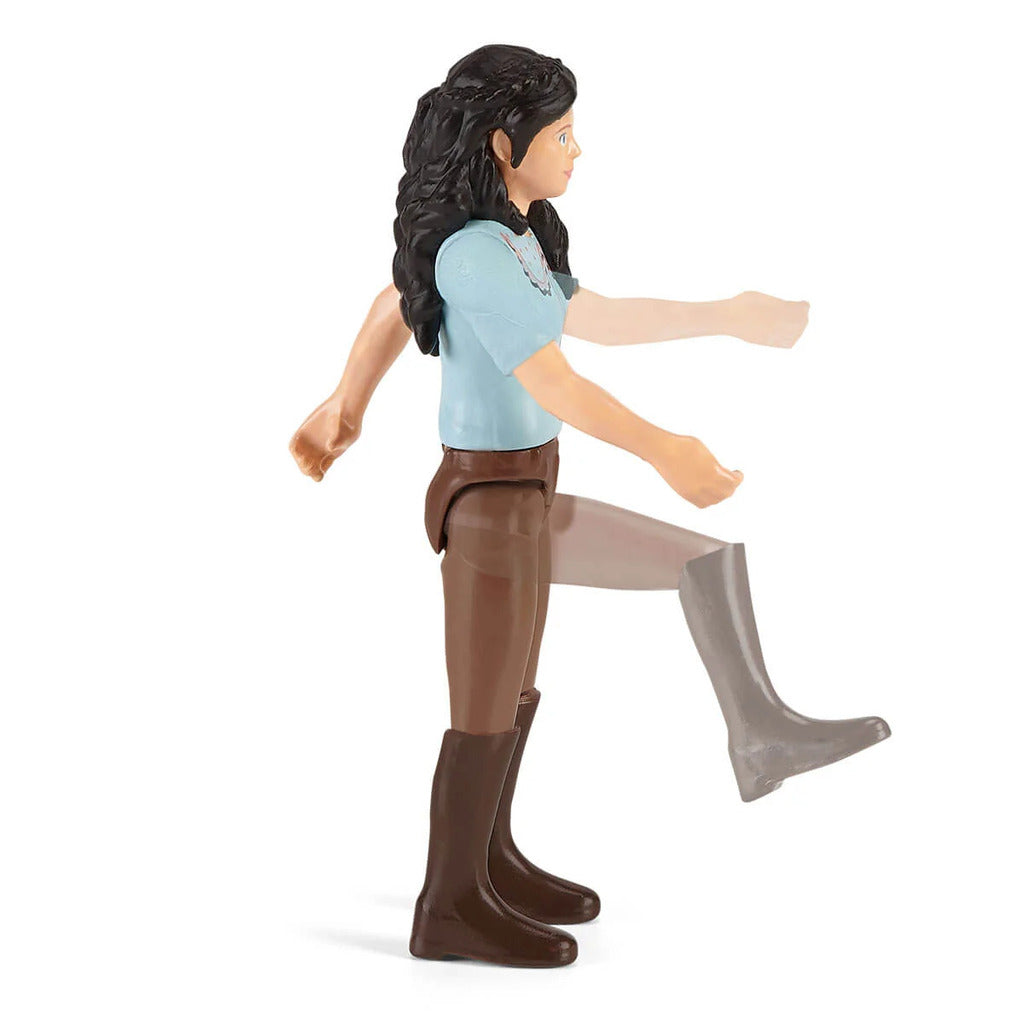 Child grooming a Horse Club horse figure using the accessories from Emily's Care Set
