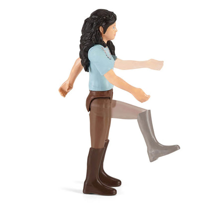 Child grooming a Horse Club horse figure using the accessories from Emily's Care Set