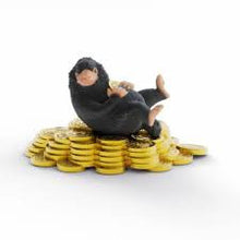 Schleich Fantastic Beasts Niffler with Gold 14905 figurine sitting on gold coins