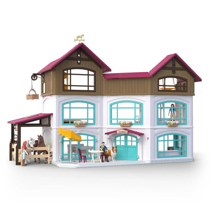 Schleich Lakeside Villa and Paddock playset with a house and adjoining fenced horse paddock