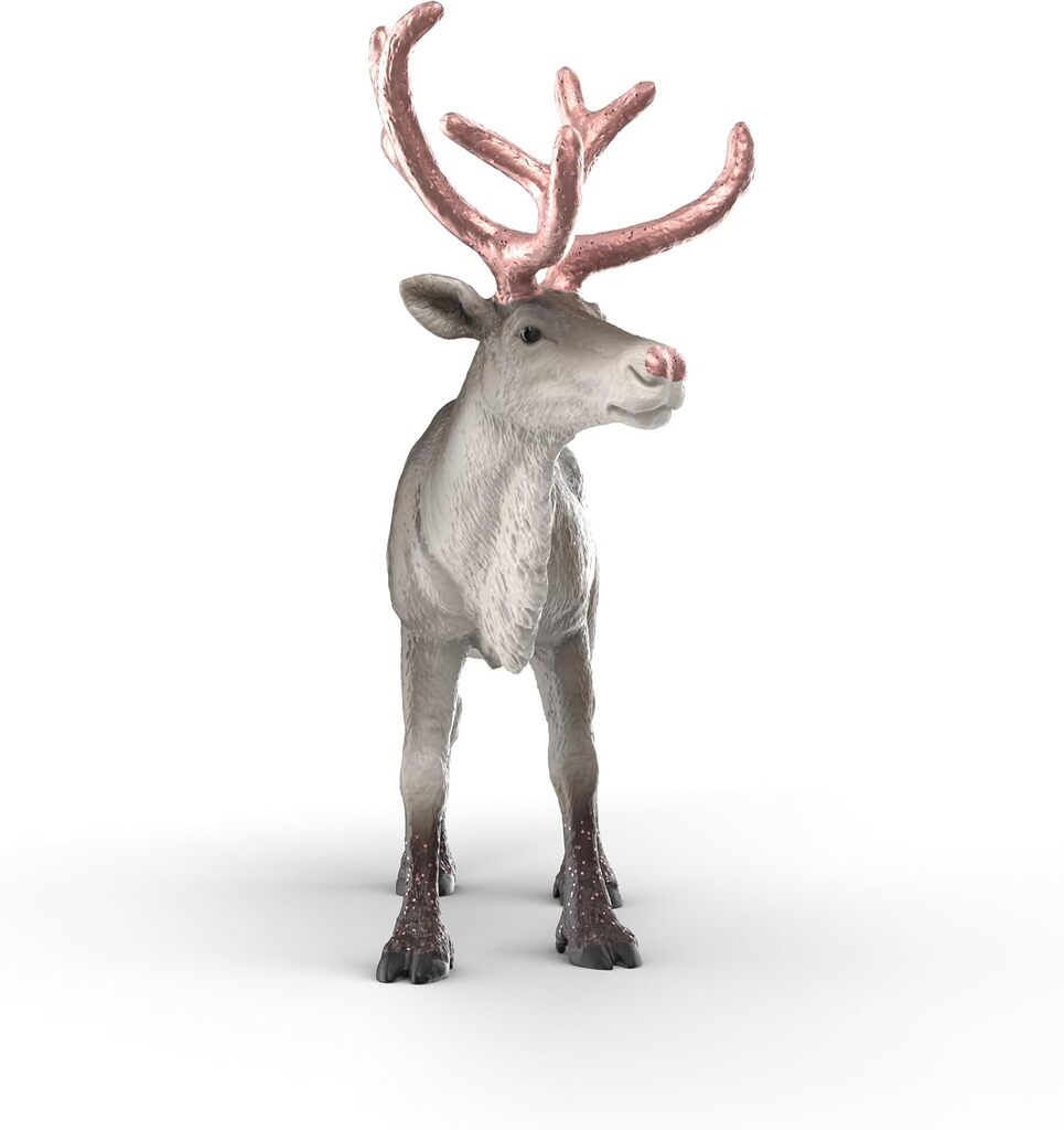 Rose Gold Reindeer placed on a mantelpiece among Christmas decorations and greenery