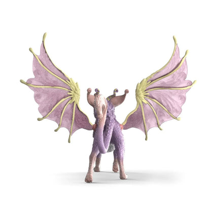 Winged Cat Dragon perched on a windowsill among a child's other magical creature figures