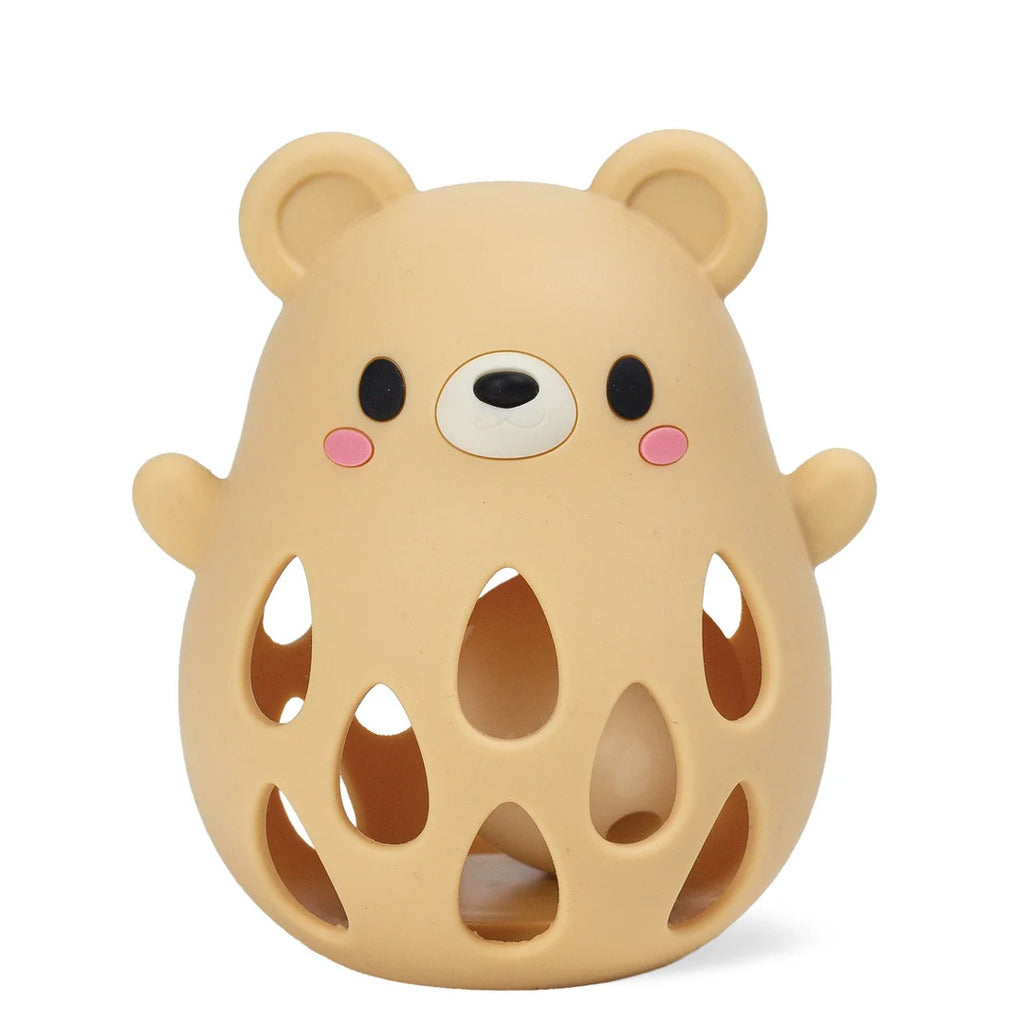 Side view of the bear silicone rattle showing its rounded ear loop and smooth moulded face detail