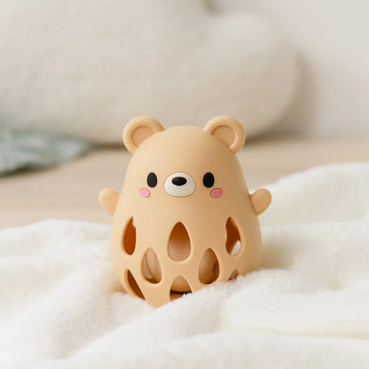 Reverse of the silicone bear rattle showing the seamless food-grade silicone finish and plain back