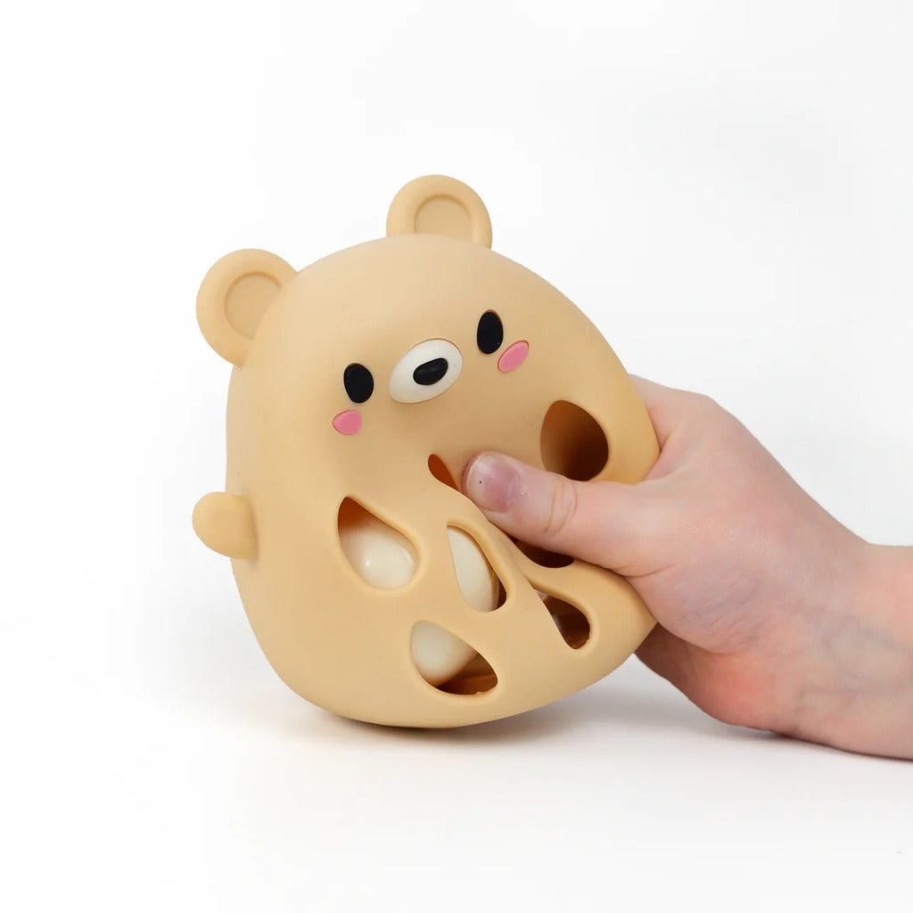 Bear silicone rattle stood upright to show the slim handle body and lightweight one-piece build
