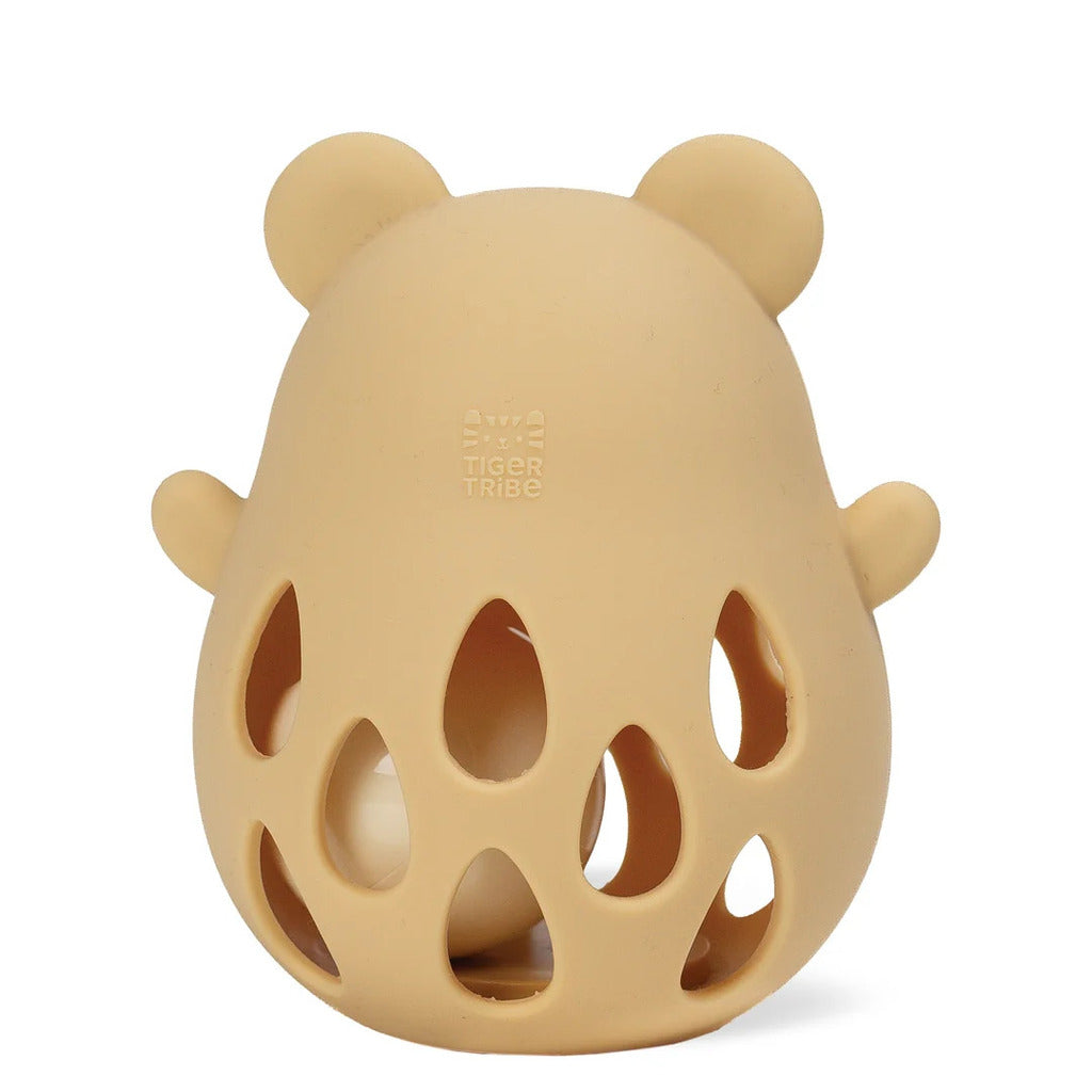 Close-up of the soft beige silicone surface and moulded bear ears, sized for a baby to grip