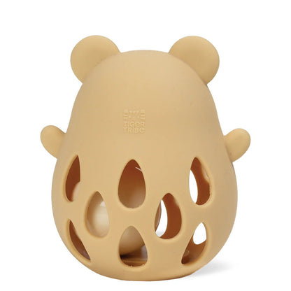 Close-up of the soft beige silicone surface and moulded bear ears, sized for a baby to grip