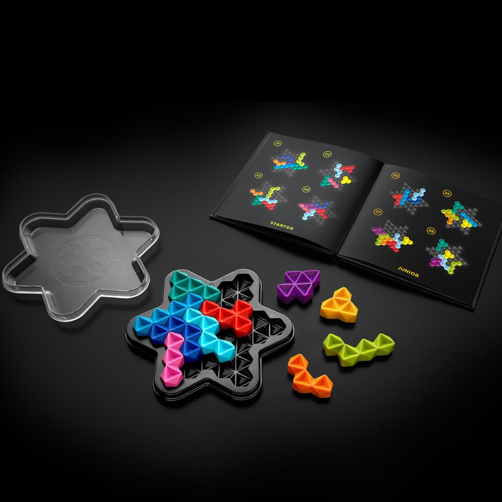 Six-pointed star game board filled with 10 hexagonal IQ Deluxe Star puzzle pieces in a completed challenge