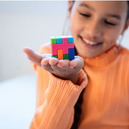 IQ Quub puzzle pieces stacked into a complete 3D cube, showing the second way to play the challenges