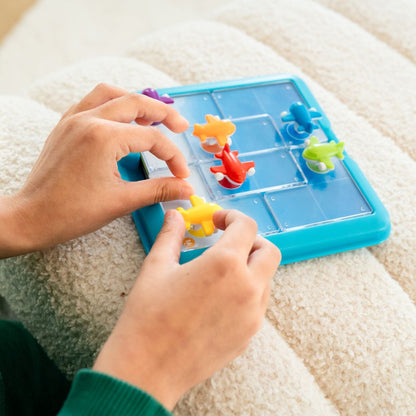 Take Off compact travel case with board, airplane pieces and double-sided challenge cards for play on the go