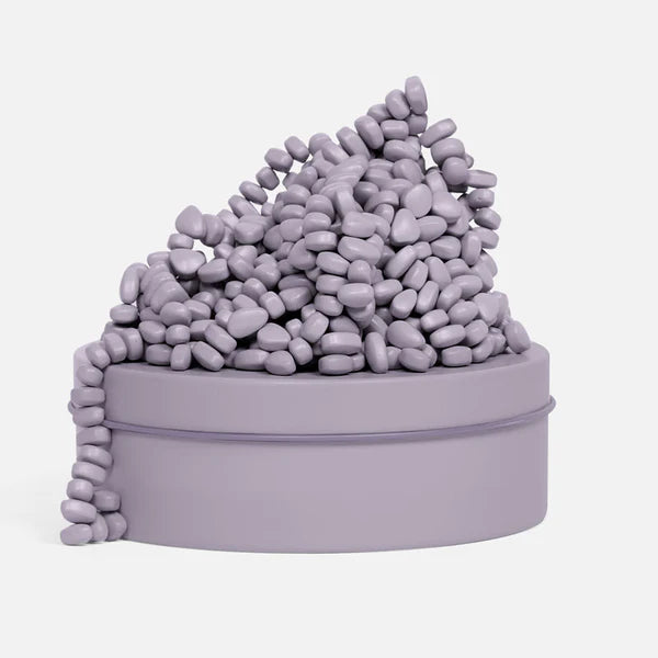 SPEKS Crags Neutral Lavender magnetic fidget putty with smooth magnetic stones in a lavender storage tin