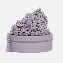 SPEKS Crags Neutral Lavender magnetic fidget putty with smooth magnetic stones in a lavender storage tin