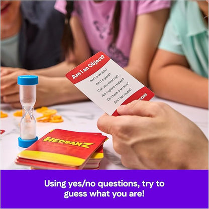 Spin Master Hedbanz 3rd Edition guessing game box featuring children wearing headbands and asking what am I questions