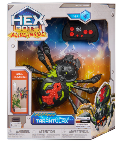 Hex Bots RC crawling spider robot on eight articulated legs beside its infrared remote control