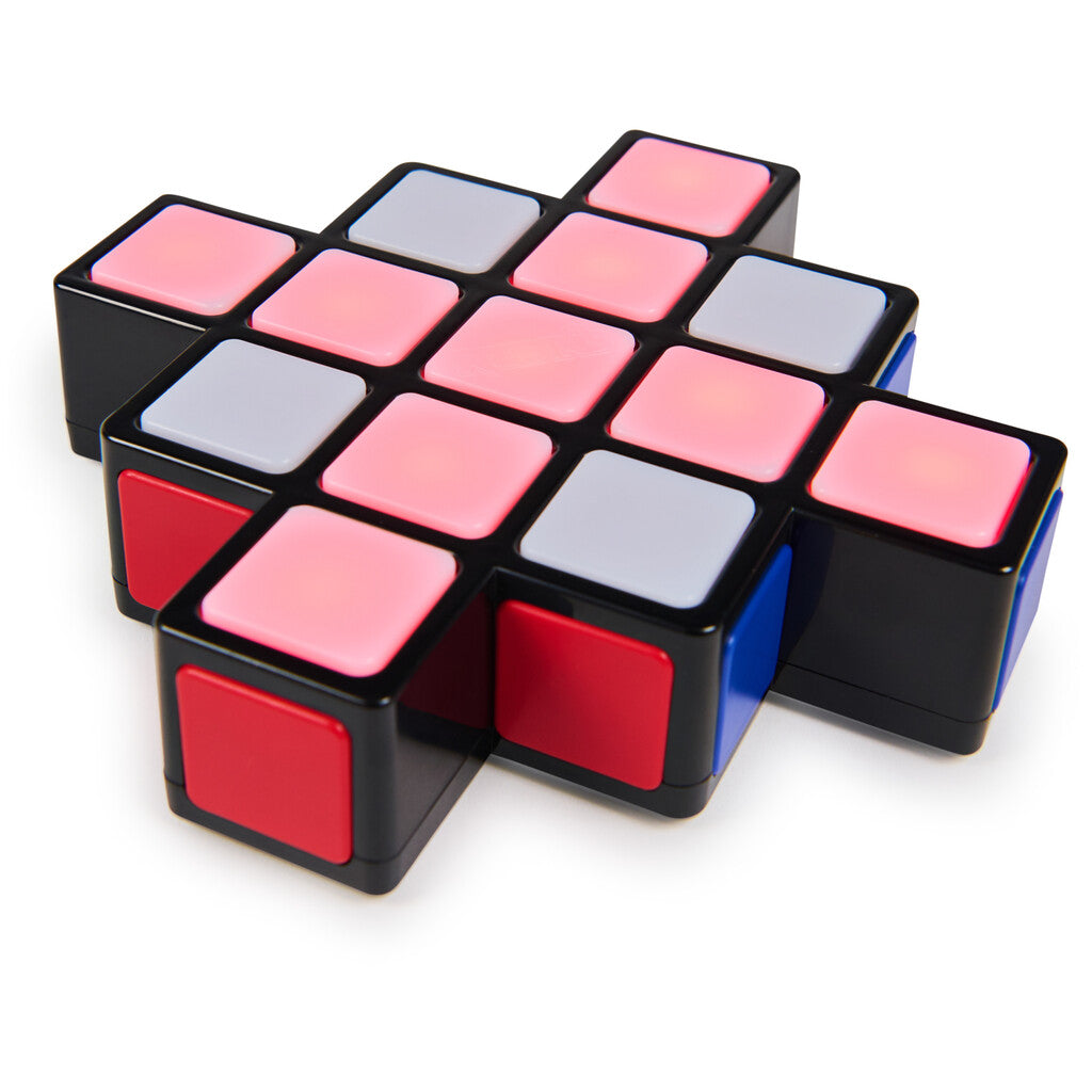 A child pressing the lit squares during a timed solo round of Rubik's Rush at the kitchen table