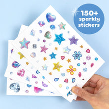 The slide-out box opened to show the winged templates and patterned sticker sheets inside