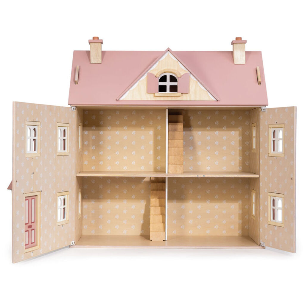 the wooden dolls house viewed from the side showing all three floors and the attic
