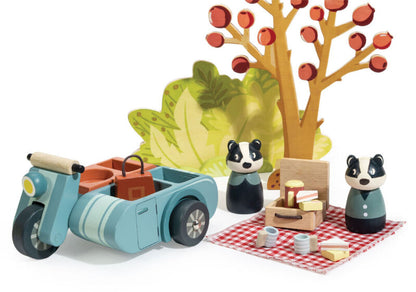 Close-up of Betty Badger with her handbag and her name printed on the wooden base