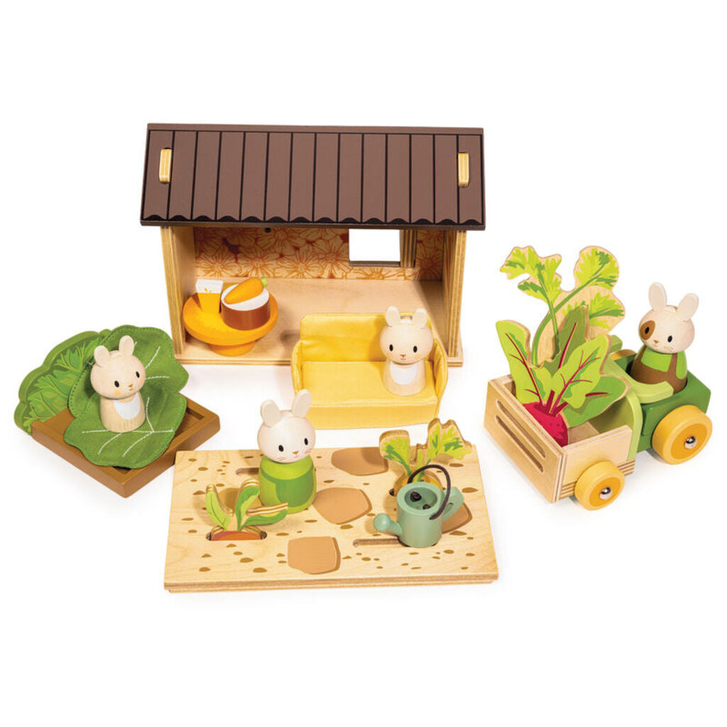 The four wooden bunnies with the crate pram, watering can and cabbage bed