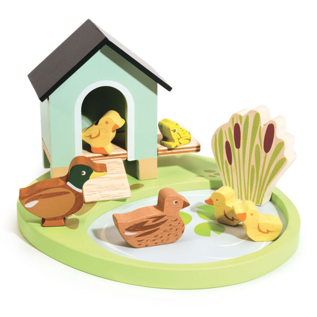 The duck family close up: two adult ducks and three ducklings in painted wood