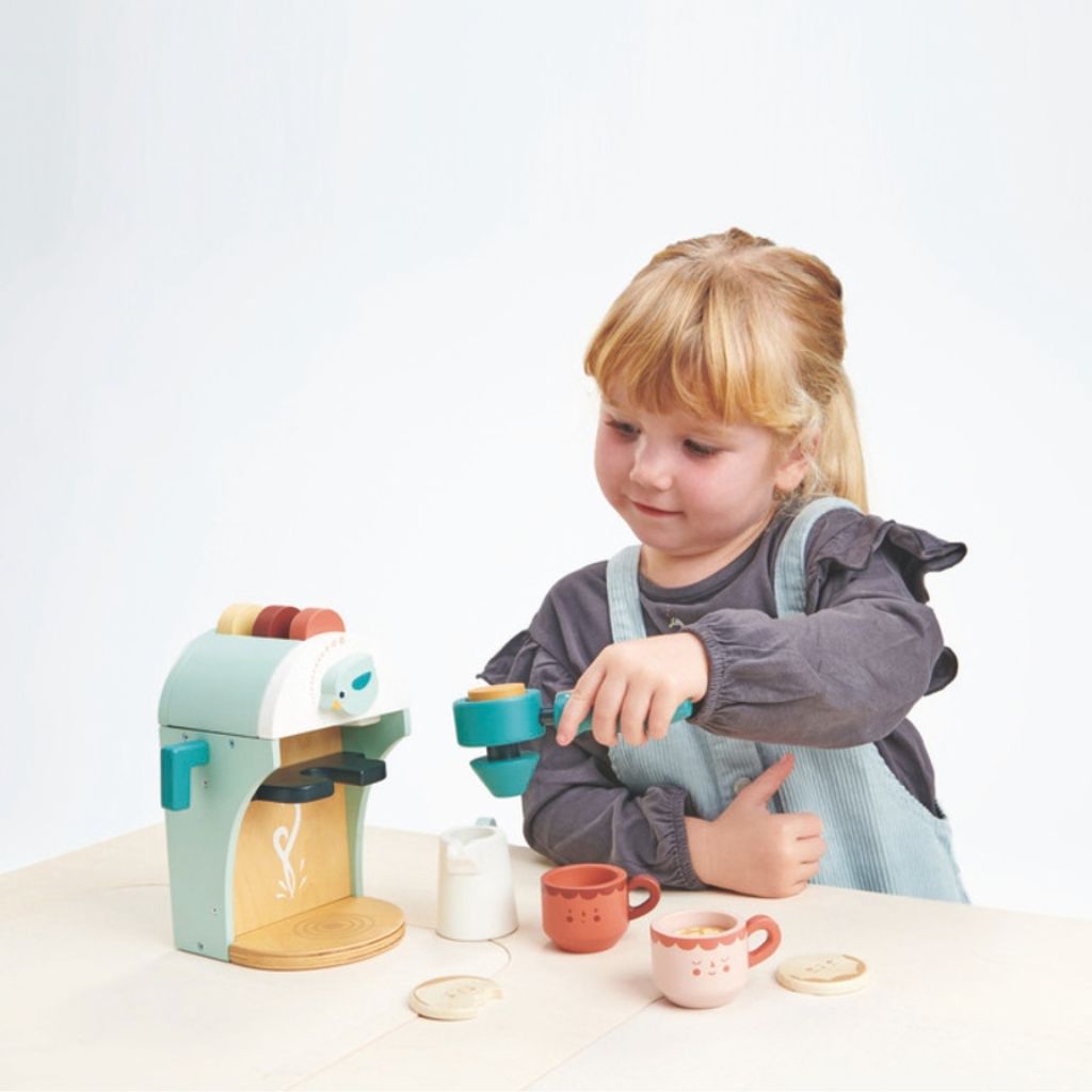 Close-up of the illustrated details on the Tender Leaf Toys wooden Babyccino coffee machine