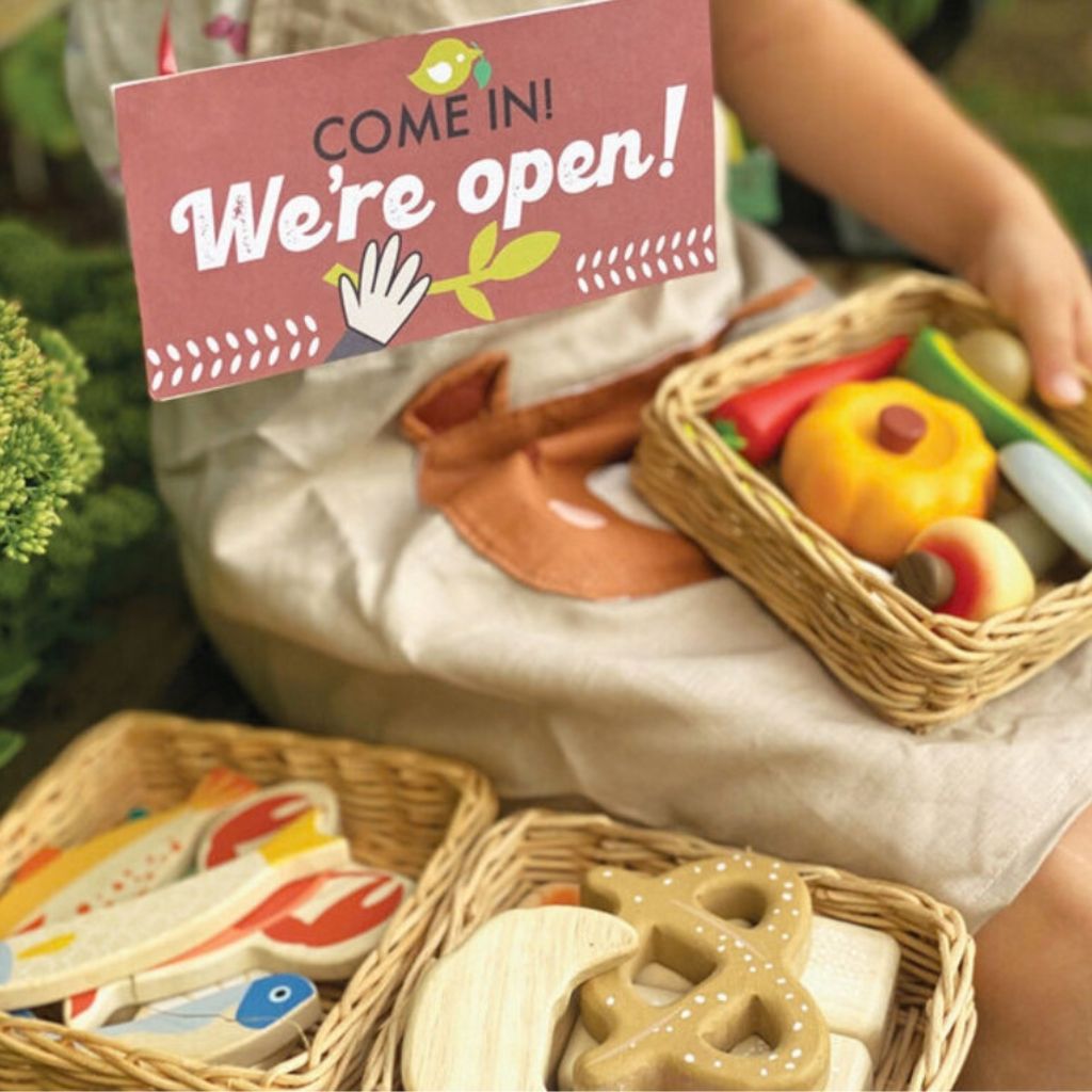 Close-up of illustrated wooden loaves and rolls from the Tender Leaf Toys Bread Basket pretend play set