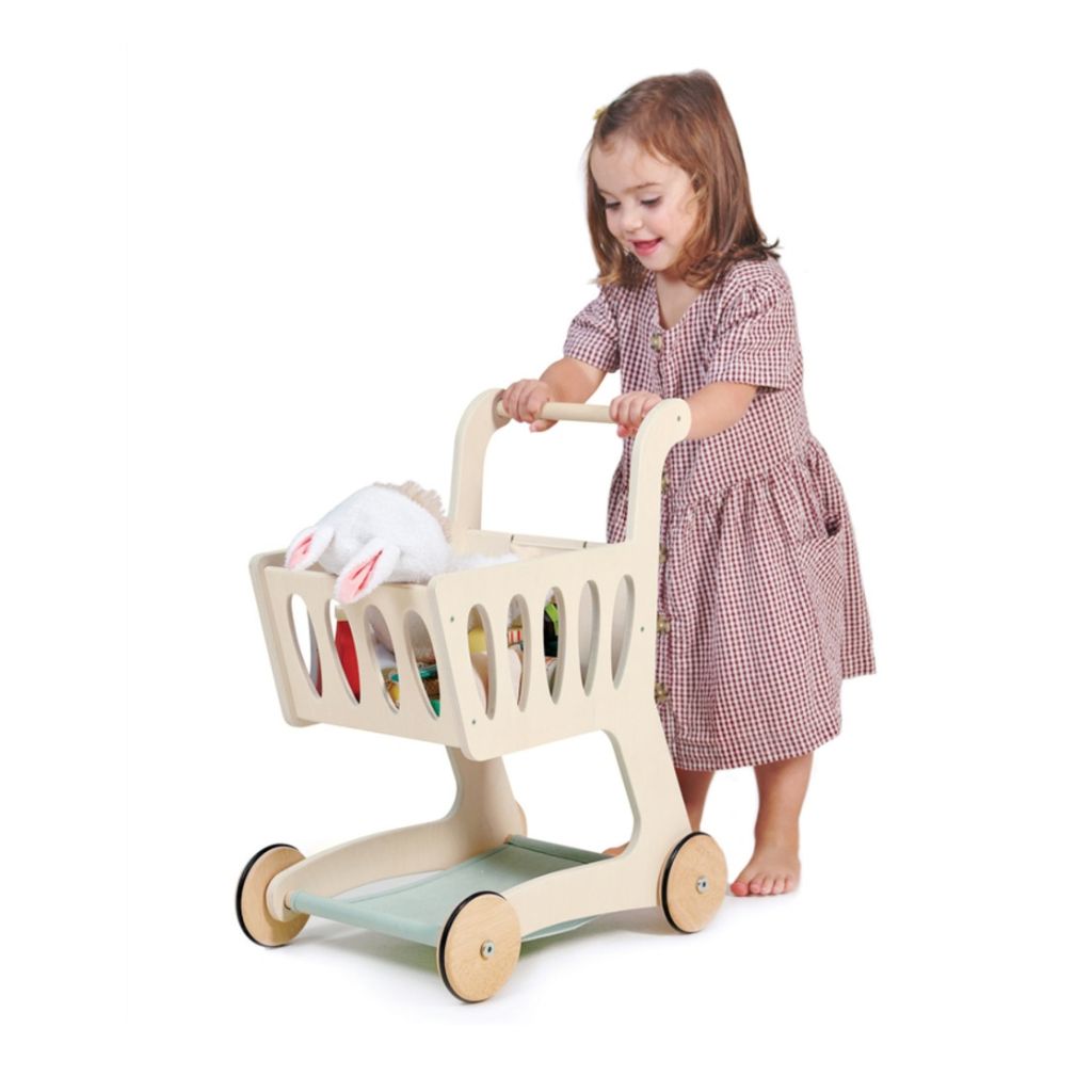 Close-up of the wheels on the Tender Leaf Toys wooden shopping cart for smooth pushing indoors