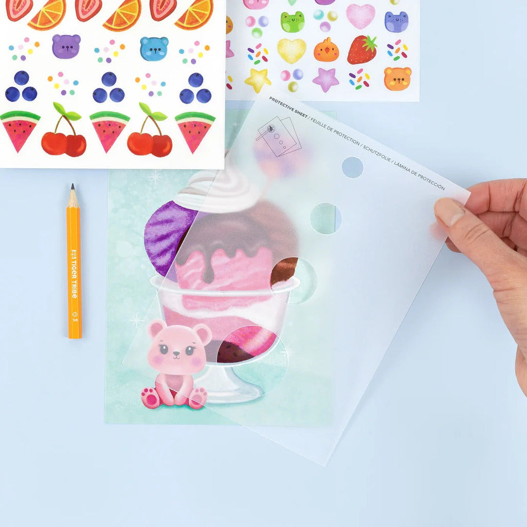 The transfer sheet peeled back to reveal the full-colour image left behind on the scene