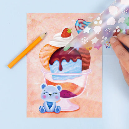 Close-up of a transfer sheet positioned over a background card, ready to be rubbed down