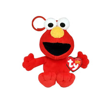 Ty Sesame Street TurtleElmo plush keychain, featuring red plush fabric, a yellow nose, white eyes, and a metal keyring, with a Ty heart-shaped hangtag.