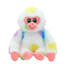 A plush monkey toy with white fur, pink face and feet, and colorful patches of yellow, blue, purple, and green, shown against a plain white background.