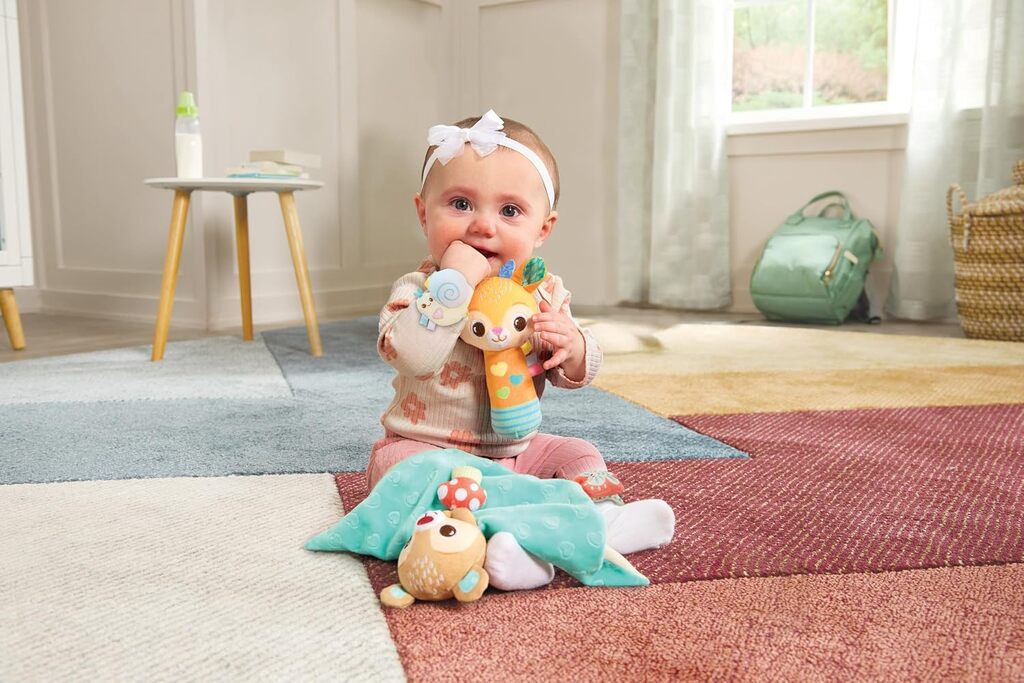 Close-up of a Forest Pals rattle character showing the crinkle ears and textured fabric tag