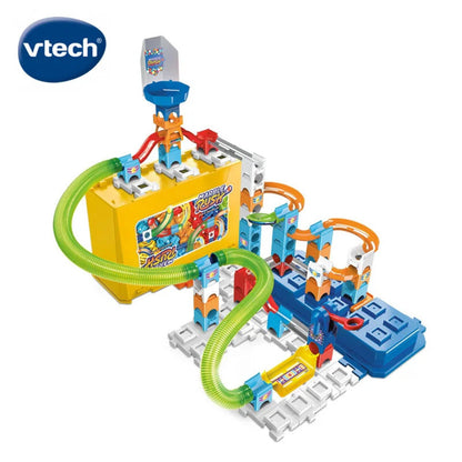 Marble Rush marbles and connector clips laid out beside the assembled stackable box set track