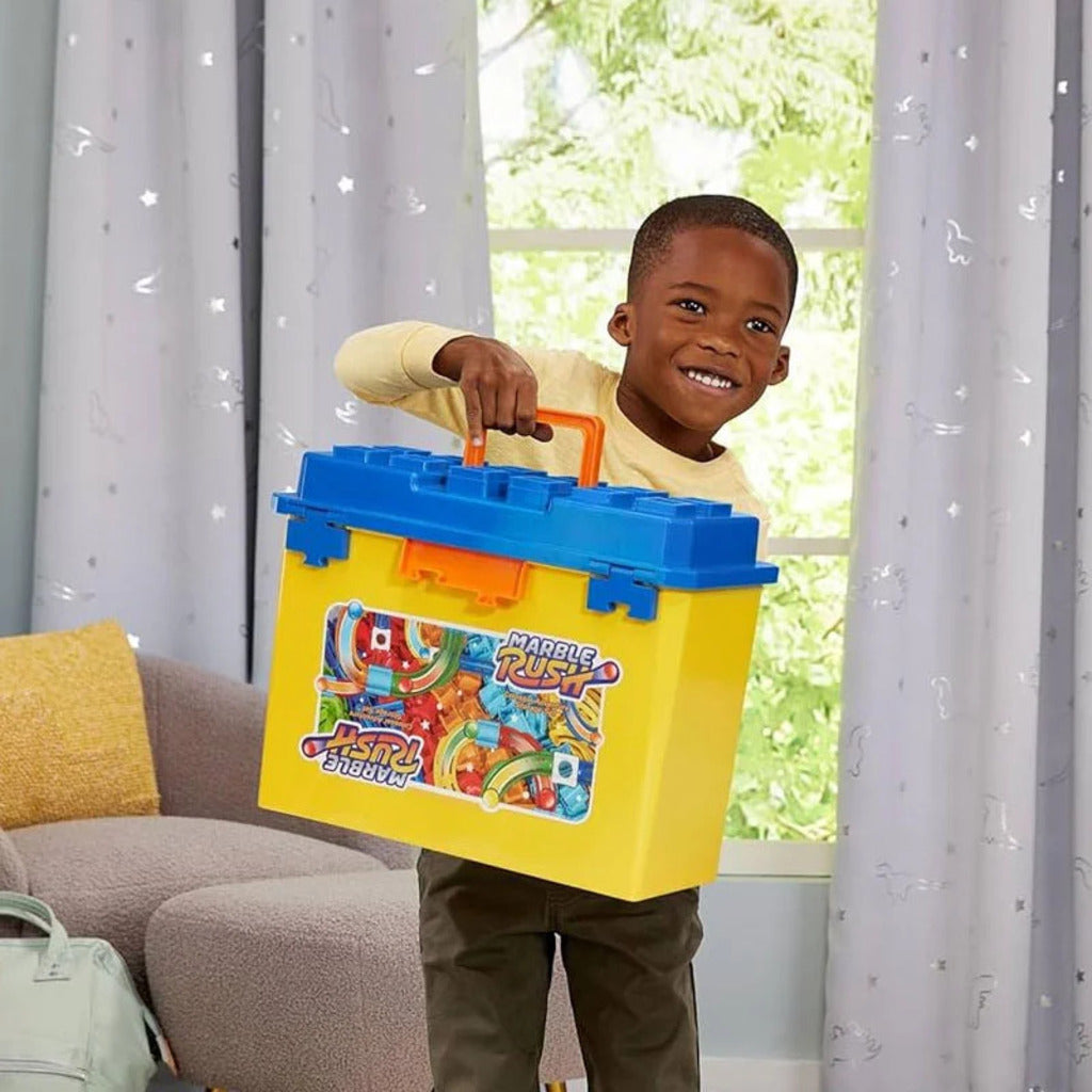 Two children building a Marble Rush marble run together at a table using the stackable track pieces