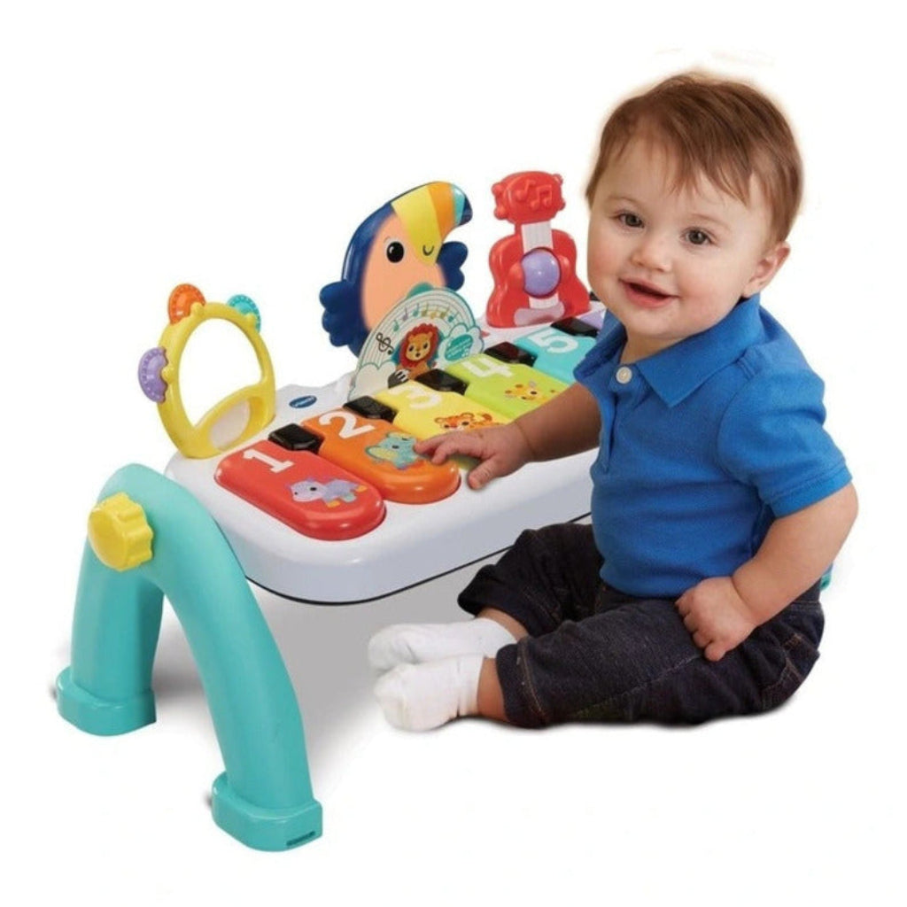 Child playing with VTech Play Along Music Centre baby musical toy with lights and sounds