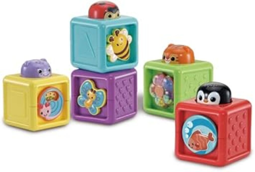 VTech Baby Pop-a-Blocks packaging showing the five activity blocks and 6 months age guidance