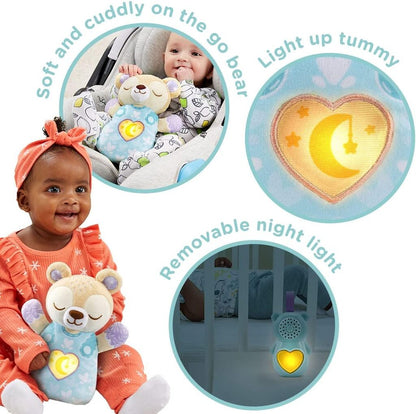 Baby Soothing Bear fastened to the side of a cot with the night light softly glowing