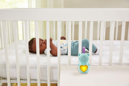Baby Soothing Bear held in an adult hand showing the plush size suitable for cuddling