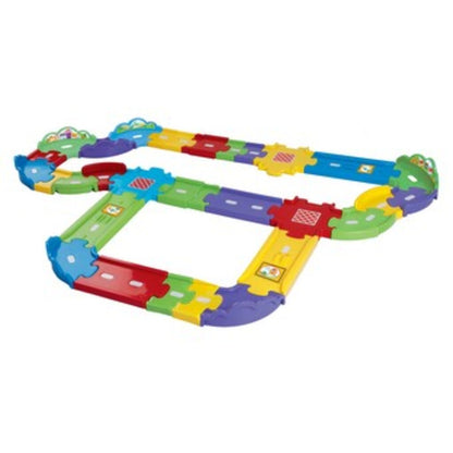 Close-up of a Toot-Toot Drivers track connector and ramp section showing how the pieces clip together