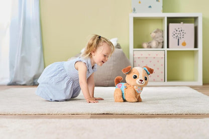 Baby crawling across a carpet following the Walk & Wag Puppy as it moves forward