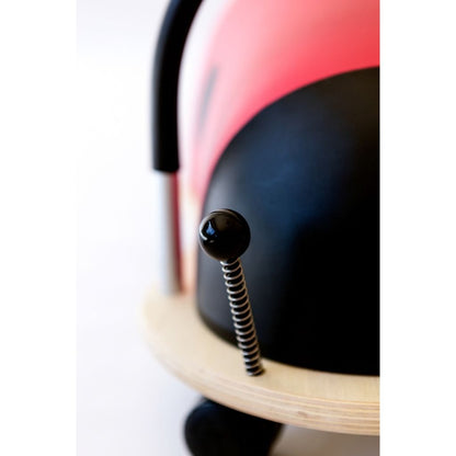 Front view of the Wheely Bug ladybug with spring-loaded eyes and antennae that double as handles