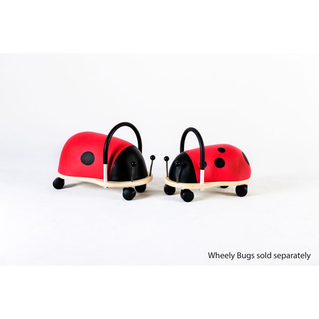 Side view of the Wheely Bug small ladybug showing its low seat height for easy independent mounting