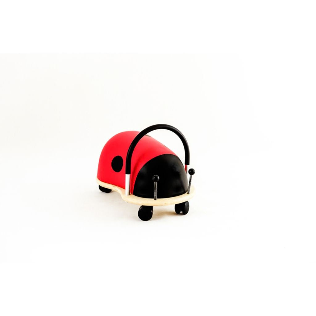 Plywood base and aluminium handle of the Wheely Bug ladybug ride-on, built for years of play