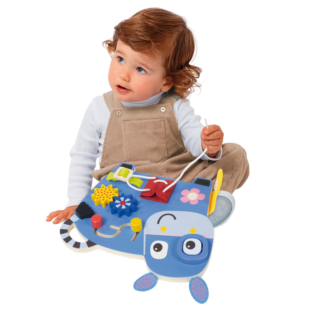 Side view of the Goula donkey activity table showing the buckled belt and shoelace to thread